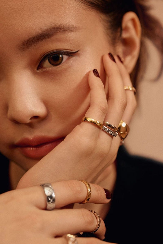 Jennie Kim from Blackpink with fashionable golden and silver ring stacks