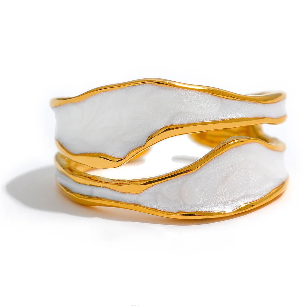 Gold and white marble-patterned RING on a white background 