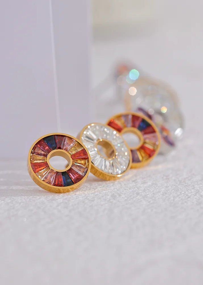 Colorful circular earrings on a white background