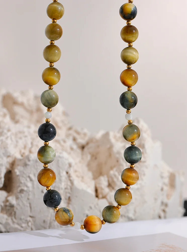 Necklace with multicolored beads on a neutral background